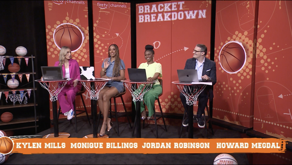 Hosts sit at chairs on an episode of Bracket Breakdown